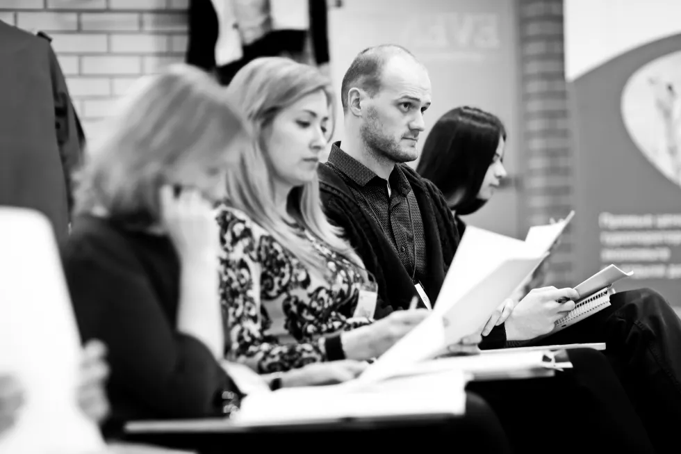 close-up-participants-seminar-conference-room-business-education