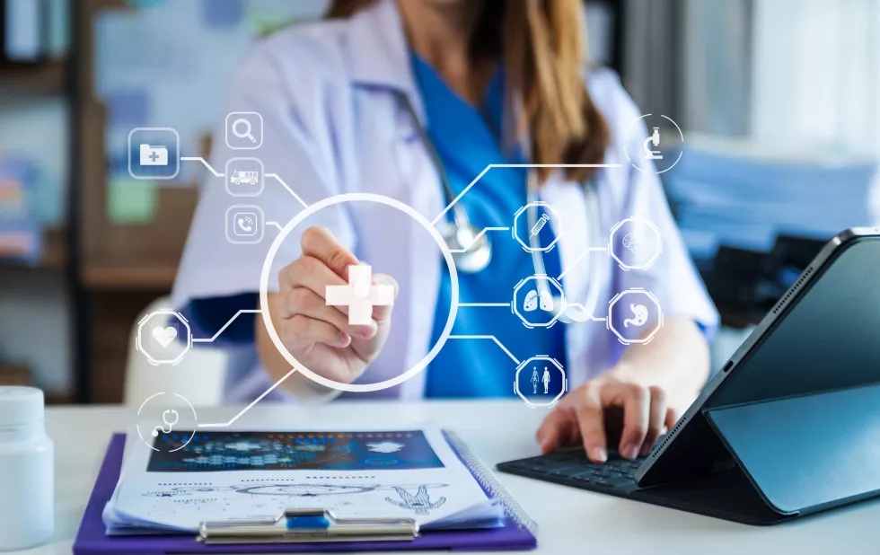 medical-technology-conceptsmart-doctor-hand-working-with-modern-laptop-computer-with-his-team-virtual-icon-diagram