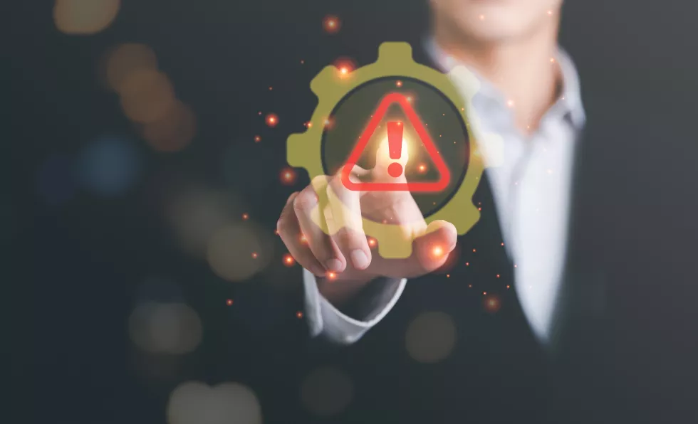 businessman-showing-warning-icon-exclamation-markalarmcomputer-virus-detecteddanger-warning-concept