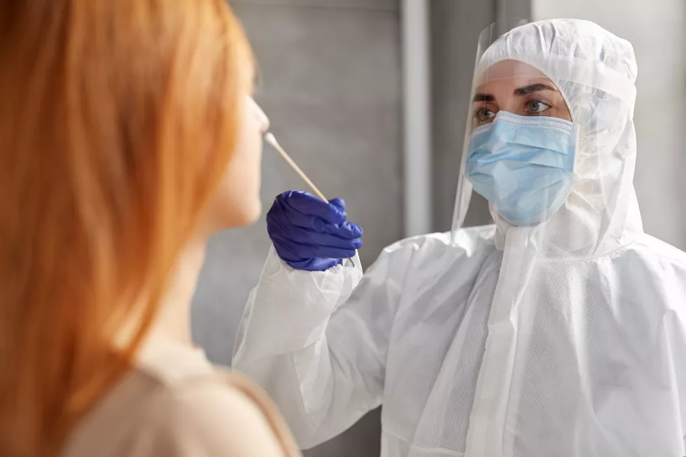 doctor-protective-wear-making-coronavirus-test