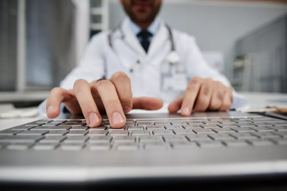 male-doctor-using-computer