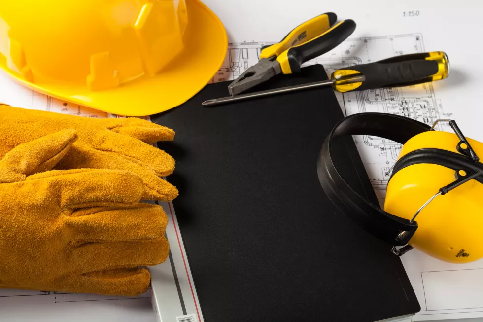 yellow-hard-hat-blueprints-construction-concept