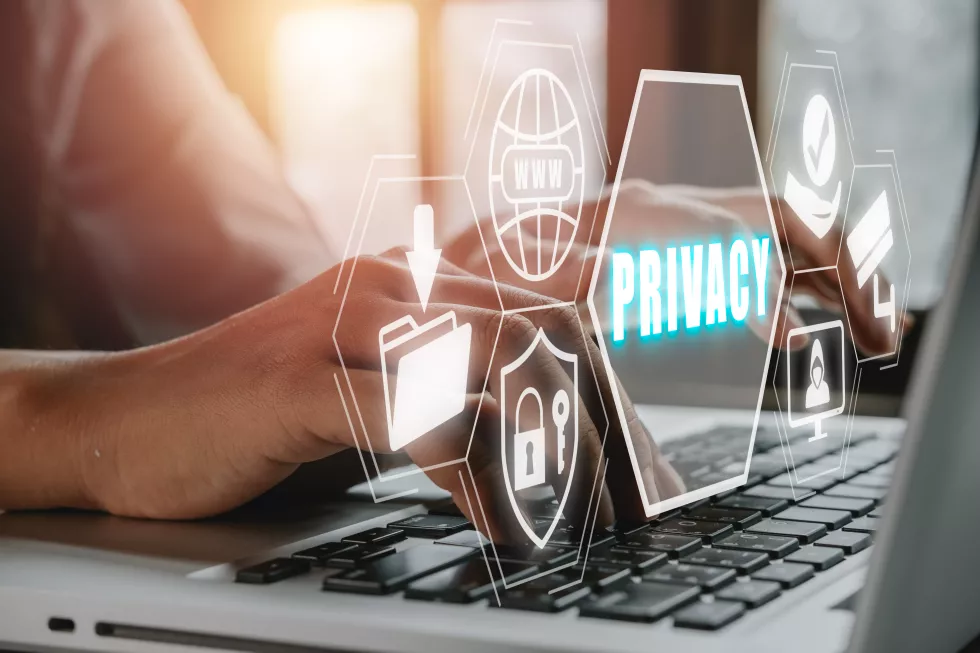 privacy-concept-business-person-typing-laptop-computer-with-privacy-icon-virtual-screen