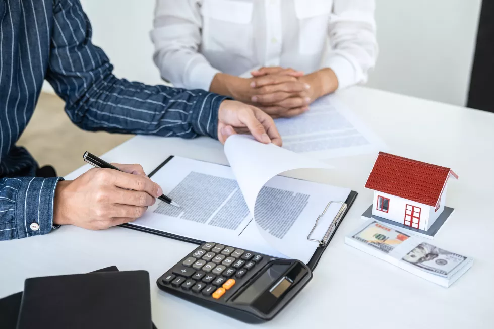 midsection-man-woman-using-smart-phone-while-sitting-table