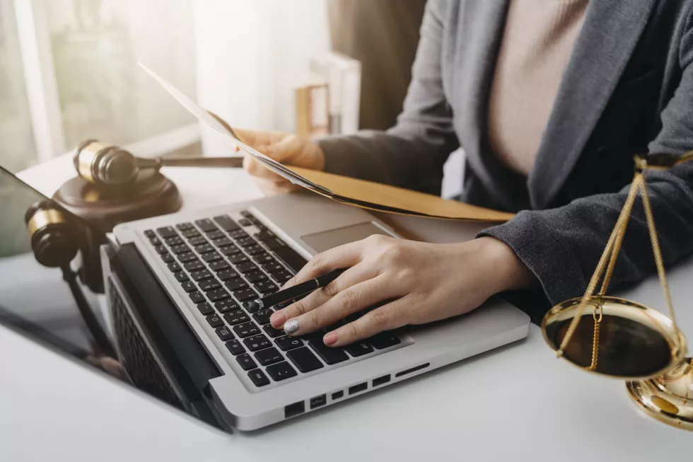 business-lawyers-discussing-contract-papers-with-brass-scale-desk-office-law-legal-services-advice-justice-law-concept-picture-with-film-grain-effect-3