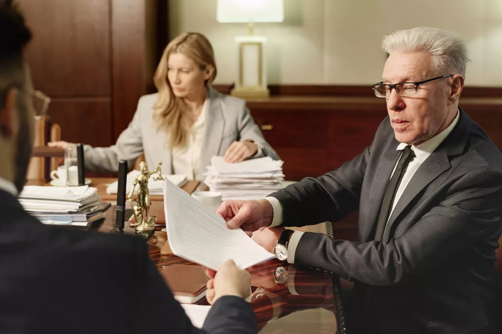 experienced-attorneys-working-with-documents-sitting-office