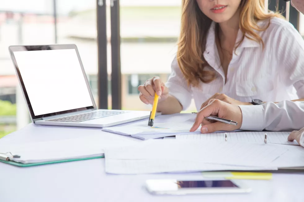 business-people-discussing-while-sitting-desk