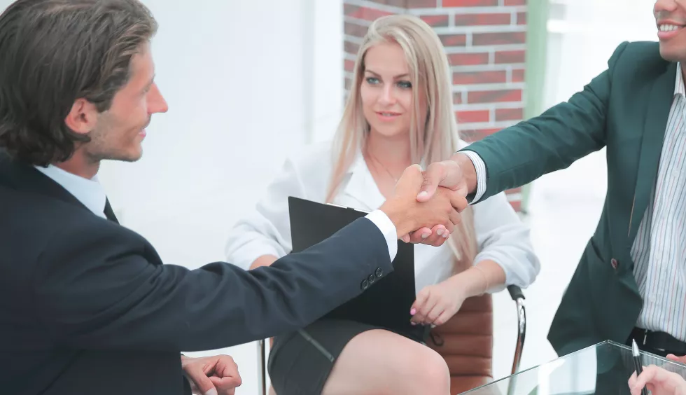 businessman-shaking-partner-hand-after-successful-negotiations