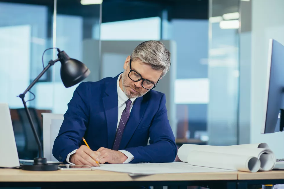 experienced-architect-designer-head-working-projector-portrait-close-up-photo