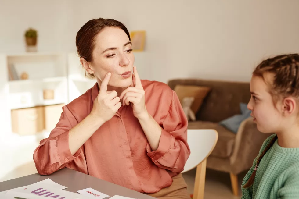 young-woman-learns-read-english-letters-little-girl-lesson-home