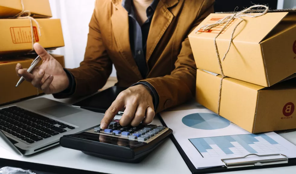 young-woman-small-business-owner-online-shopping-home-taking-note-orders-from-customers-with-mobile-phones-sme-entrepreneur-freelance-life-style-concept