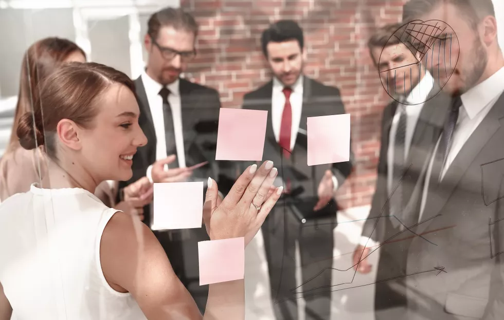 manager-shows-business-team-business-notes